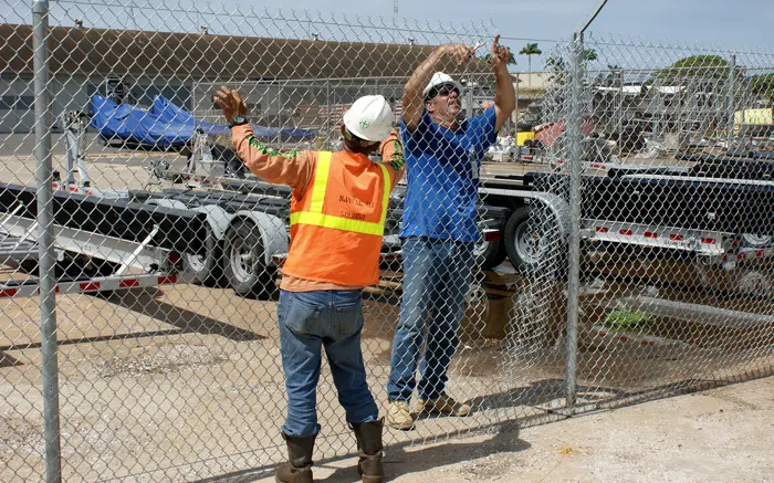 Fence crew on a chain link jobsite